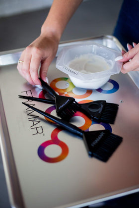 FRAMAR brushes in hand showing size and ergonomic grip for comfort