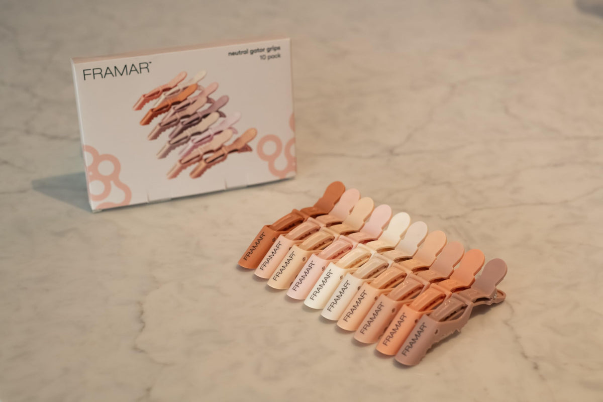 framar clip in hand for size comparison and easy one-handed use benefit