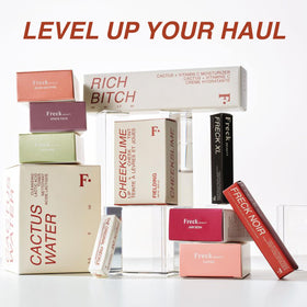 Freck Beauty pen in a makeup bag showing travel-ready, durable design