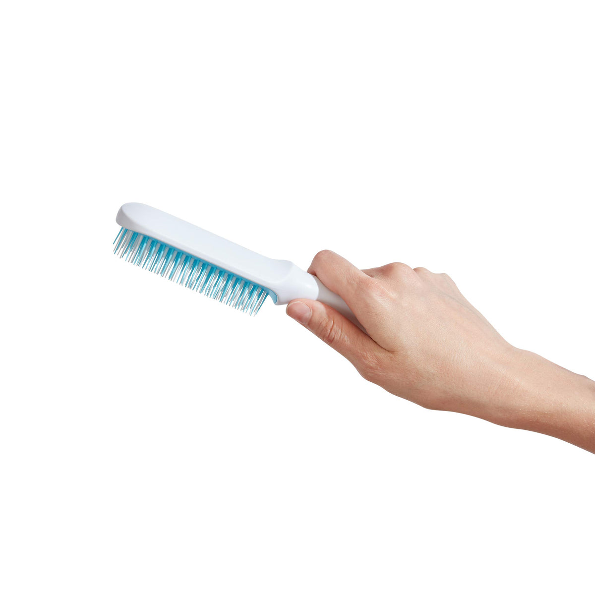 Frida Baby brush used on towel-dried hair showing effective wet detangling