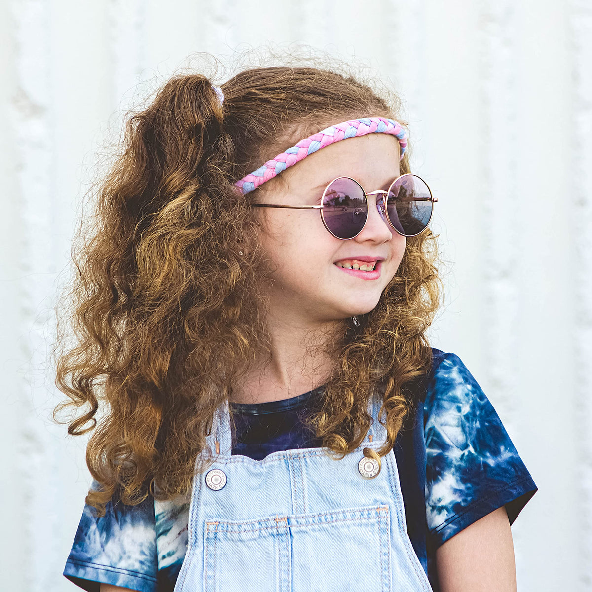 FROG SAC four tie-dye headbands laid flat showing color variety for styling