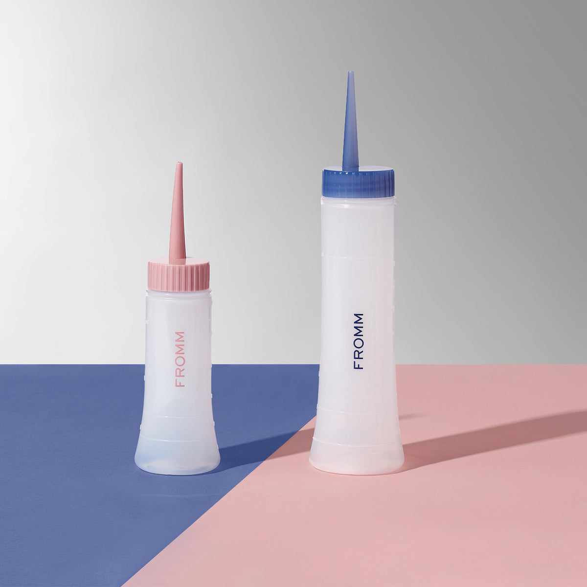Fromm applicator used by stylist applying color to hair for tidy, targeted placement