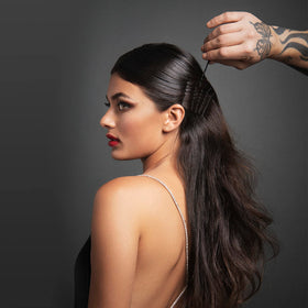 Fromm pins securing an updo in use for reliable hold