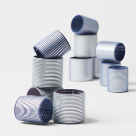 Fromm ProVolume rollers held in hand illustrating lightweight build and easy handling benefit