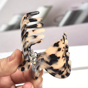 Fsmiling clips holding full updo displaying strong grip for thicker hair
