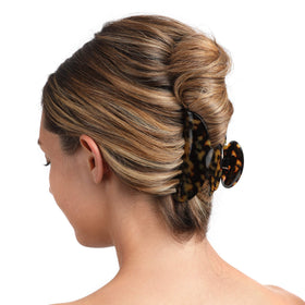 Fsmiling clips securing half-up hairstyle illustrating quick, tidy styling benefit