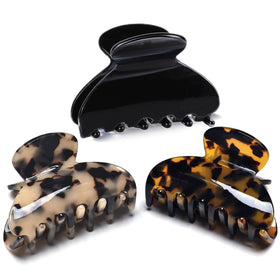 Fsmiling front view of 3-pack tortoise and leopard clips showing stylish patterns and size benefit