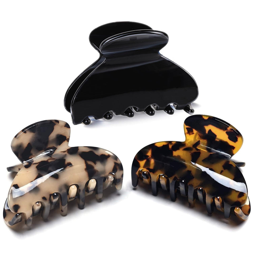 Fsmiling front view of 3-pack tortoise and leopard clips showing stylish patterns and size benefit