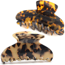 Fsmiling front view tortoise shell clip showing elegant hold benefit