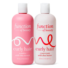 Function of Beauty front packaging of curly shampoo and conditioner showing bottles and label benefits