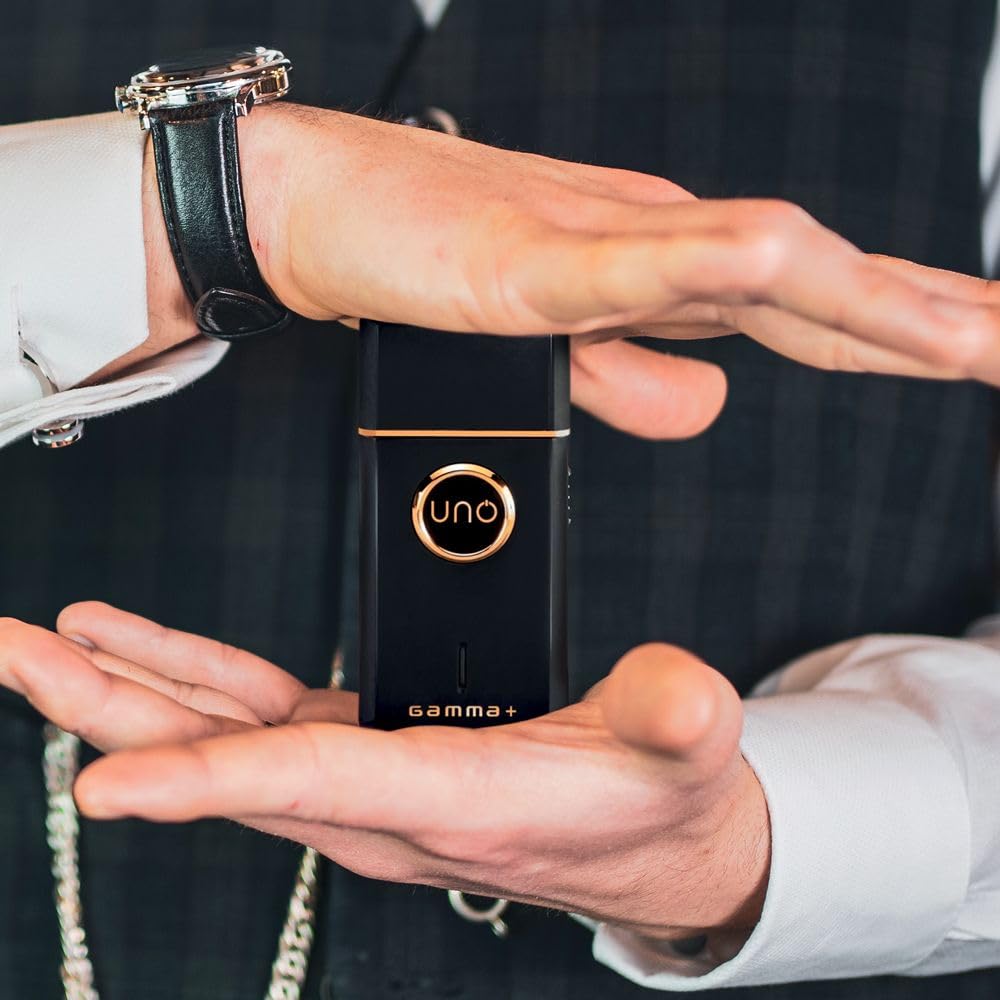 GAMMA+ Uno held in hand to show pocket-size scale and easy portability