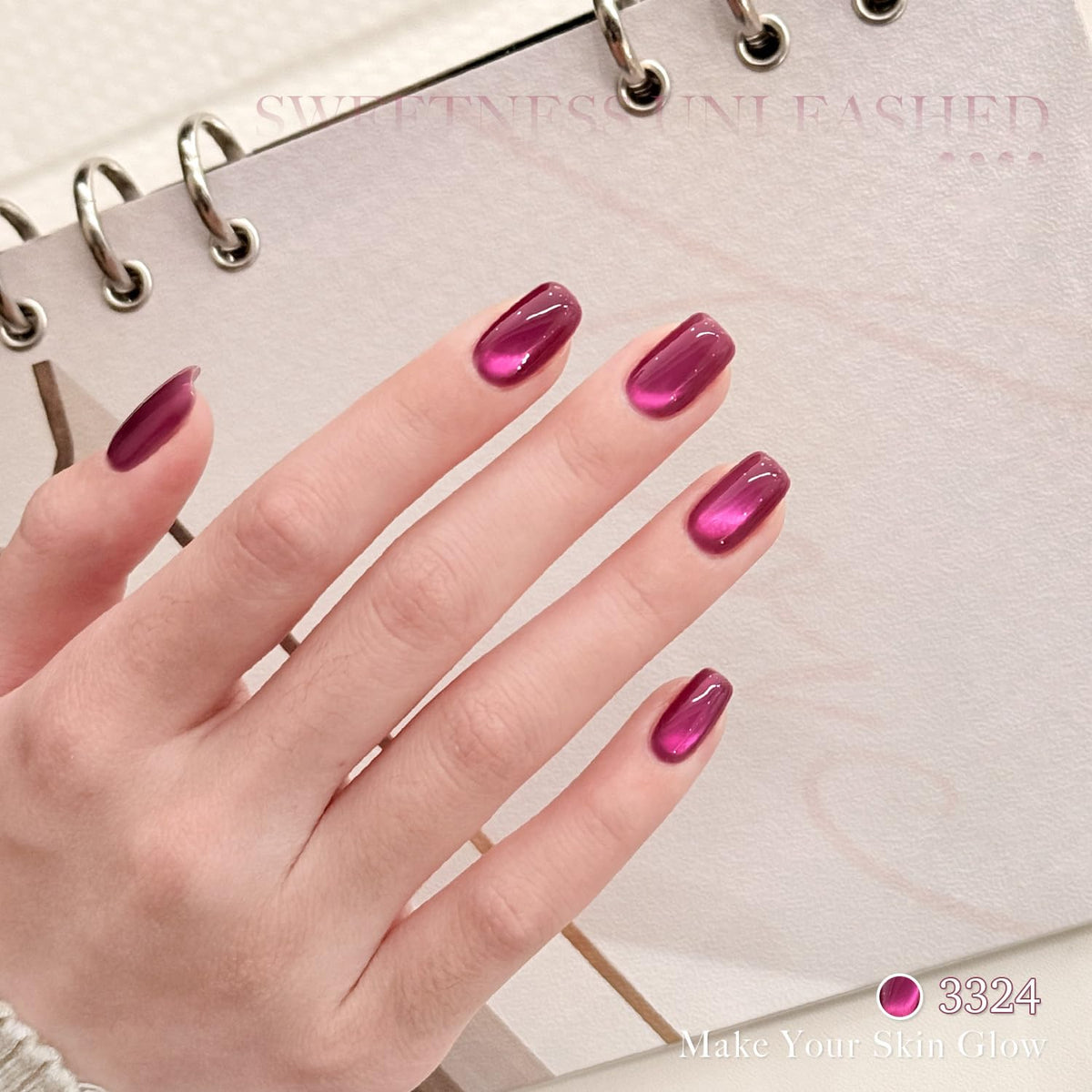GAOY magnet held over wet polish, demonstrates how to form cat-eye lines