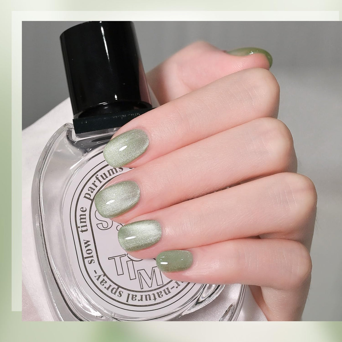 GAOY swatch on nail tip displaying holographic green shift, illustrates visible shimmer benefit