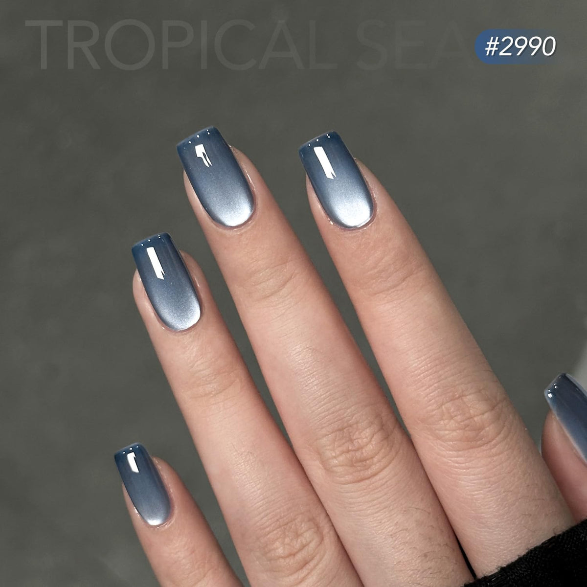 GAOY magnet held over wet nail forming a clear cat-eye stripe, demonstrating easy pattern creation