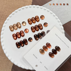 GAOY worn manicure on hand displaying brown cat eye shimmer, salon-quality finish at home