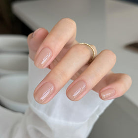 GAOY nail swatch on hand displaying sheer-to-buildable nude benefit