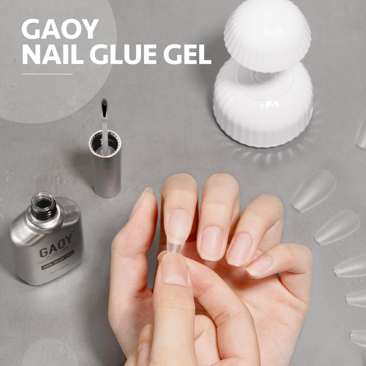 GAOY applying glue gel to false nail demonstrating secure bonding