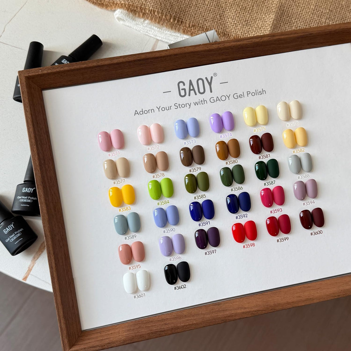 GAOY scale comparison bottles in hand showing compact size and travel convenience