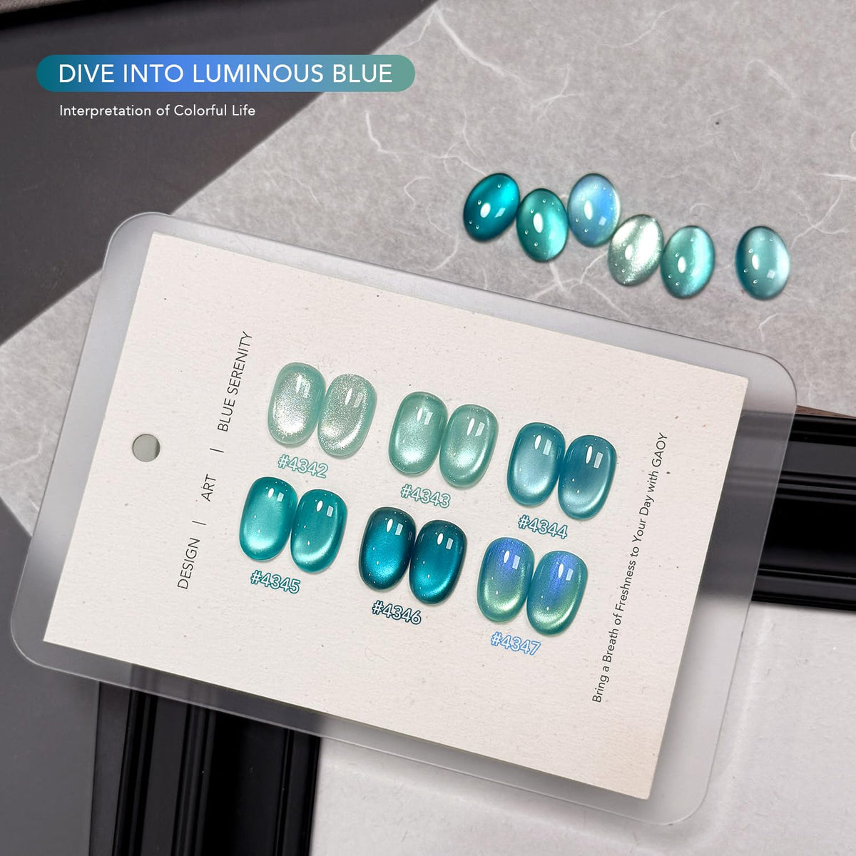 GAOY nail swatch fan showing six holographic blue shades for color planning