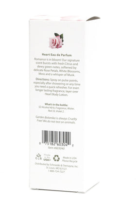 Garden Botanika Heart bottle beside everyday items demonstrating 3.2 fl oz scale