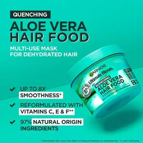 Garnier Fructis applied in hair during salon‑style treatment for deep moisture