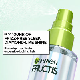 Garnier Fructis in use during blowdry to activate smoothing complex while protecting hair