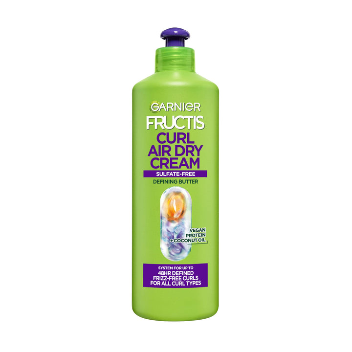 Garnier Fructis front packaging showing XL 16.9 oz and curl claims