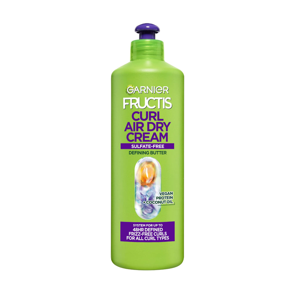 Garnier Fructis front packaging showing XL 16.9 oz and curl claims