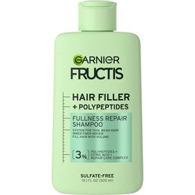 Garnier Fructis front packaging showing bottle and product name benefits