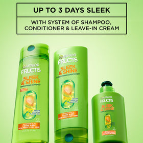 Garnier Fructis in hand for size reference and convenient everyday use