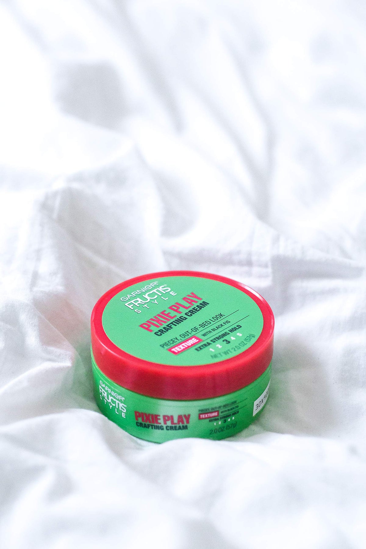 Garnier Fructis Pixie Play cream texture close-up illustrating creamy, non-sticky formula