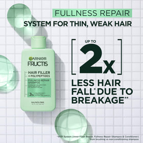 Garnier Fructis close-up of bottle pump and ingredient label for clear usage
