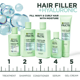 Garnier Fructis shampoo being applied to wet hair for nourishment