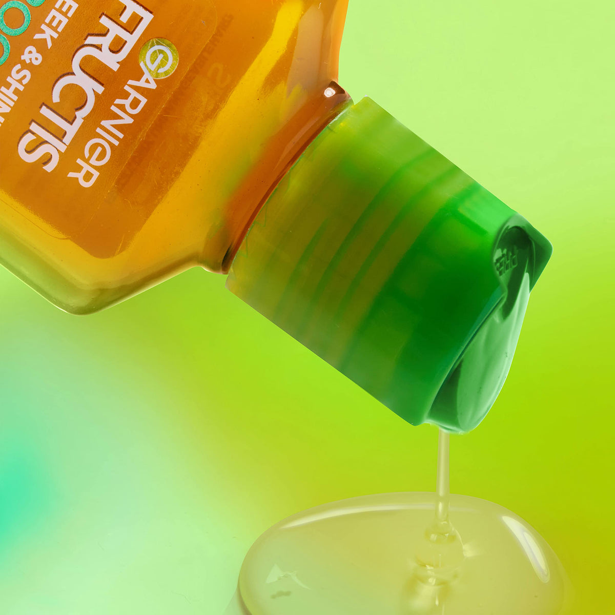 Garnier Fructis bottle held in hand demonstrating travel-friendly size