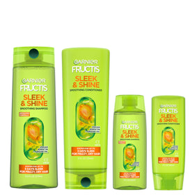 Garnier Fructis front packaging showing full and travel bottles and benefits