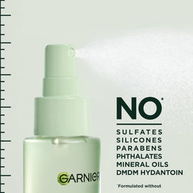 Garnier Fructis spraying into hair showing instant root lift benefit