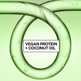 Coconut water visual next to Garnier Fructis bottle to show hydrating ingredient benefits