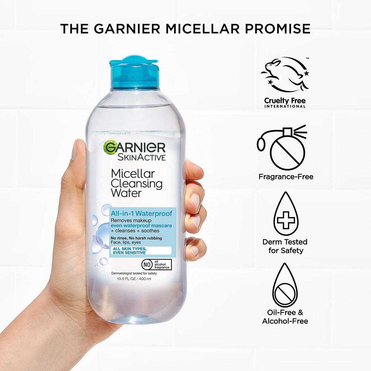 Garnier bottle beside passport and travel items, compact 400mL travel benefit