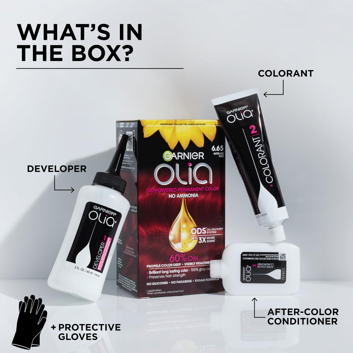 Garnier Olia hands wearing gloves applying color to roots for even coverage