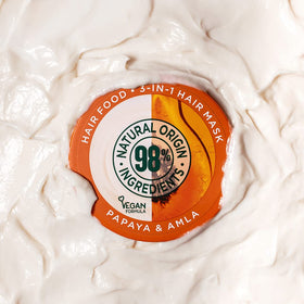 Garnier jar in hand showing 390ml scale and value benefit