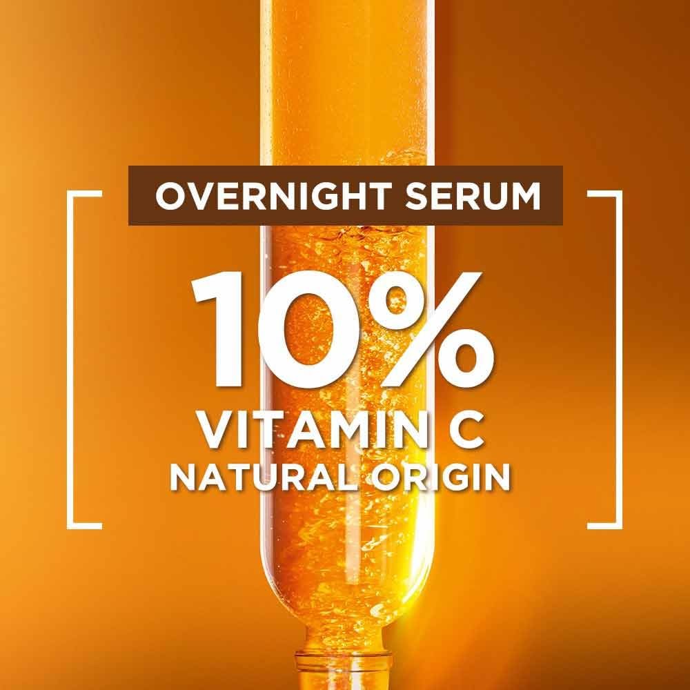 Garnier serum application on face as part of nighttime skincare routine