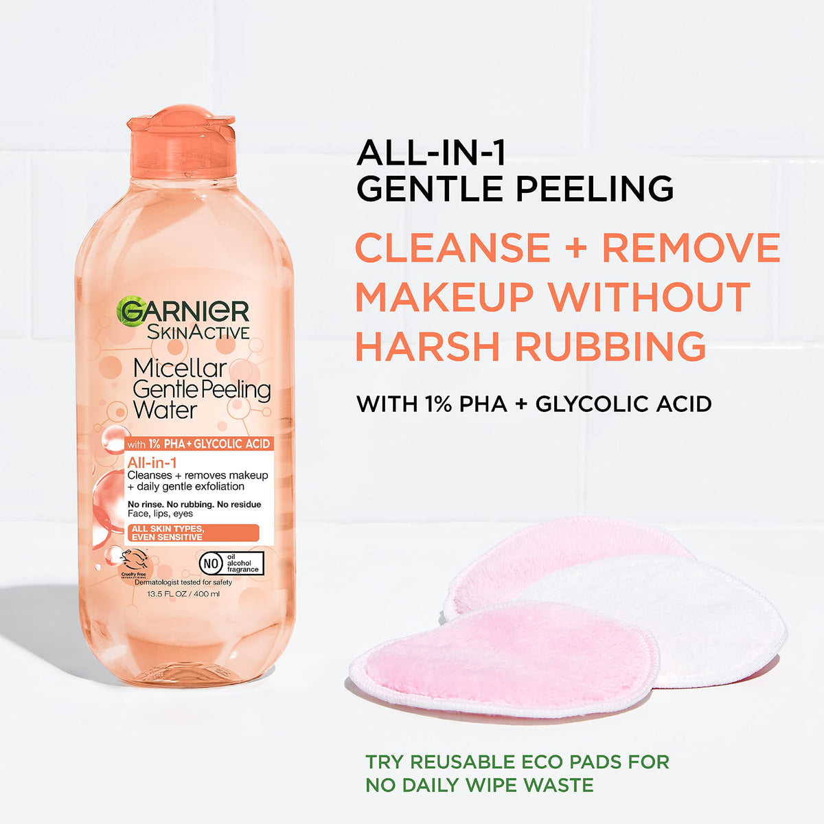 Garnier bottle in hand shows product size and travel-friendly benefit