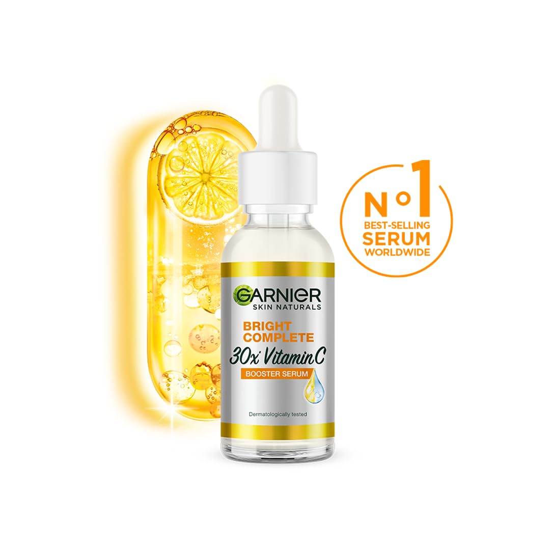 Garnier Vitamin C booster 30ml bottle close-up highlighting compact travel-friendly size