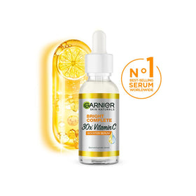 Garnier Vitamin C booster 30ml bottle close-up highlighting compact travel-friendly size