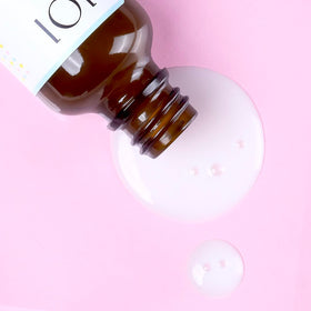 Geek & Gorgeous bottle staged on bathroom shelf for routine integration and lifestyle appeal