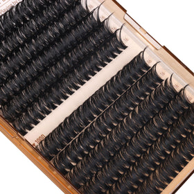Geeneiya applying clusters in a mirror to show DIY control and salon-like results