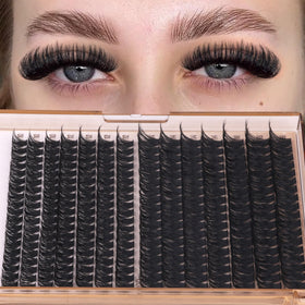Geeneiya hand applying a cluster lash with tweezers demonstrating easy DIY placement