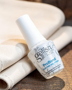 Gelish ProBond in salon use with technician applying product for longer-lasting nails