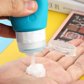Gemice silicone body being squeezed to dispense lotion showing controlled dispensing benefit