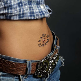 Generic demonstrating tattoo application on arm with water for quick use